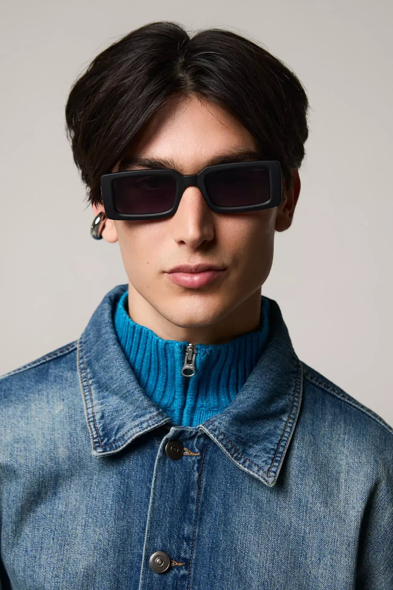 Malick Carbon Sunglasses worn by a male model in a denim jacket and blue turtleneck, showcasing stylish UV protection.