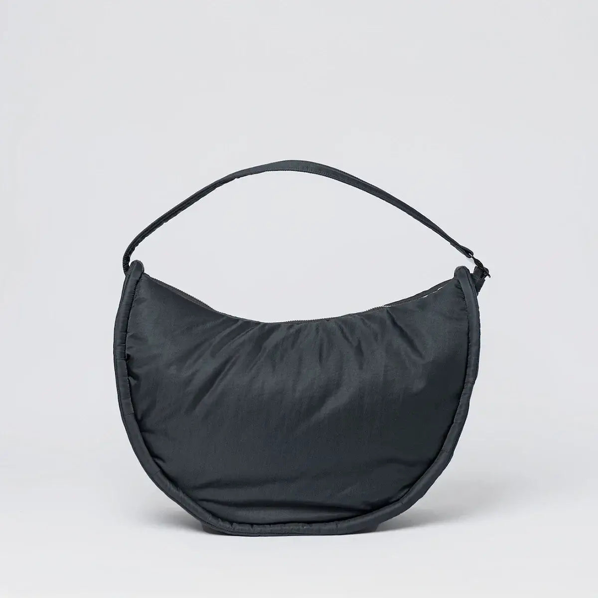 Curve Crossbody Round L Black Shoulder Bag in a sleek design, featuring a padded shoulder strap and water-resistant material.