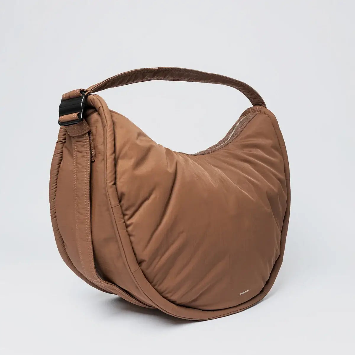 Curve Crossbody Round L Dark Taupe Shoulder Bag, water resistant and lightweight design for convenience.
