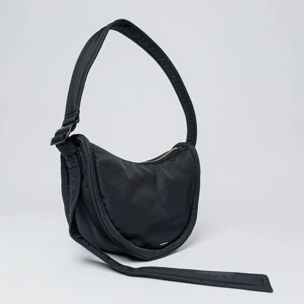 Curve Crossbody Round S Black Shoulder Bag with padded strap and sleek design, ideal for everyday use.