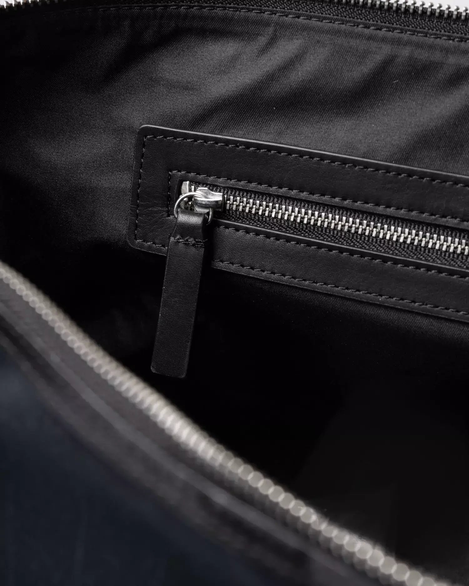 Interior view of Everyday Weekender Bag Medium Black Shoulder Bag showcasing zip pocket and lining.