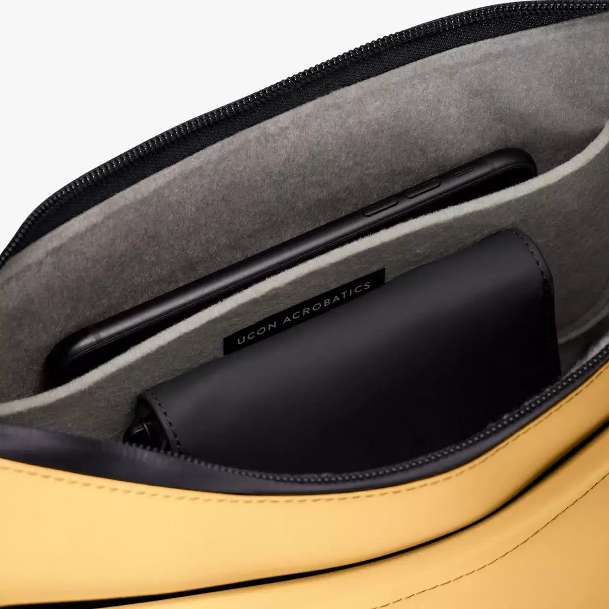 Alva Medium Lotus Infinity Lemon Shoulder Bag interior pockets showcasing smartphone and wallet.