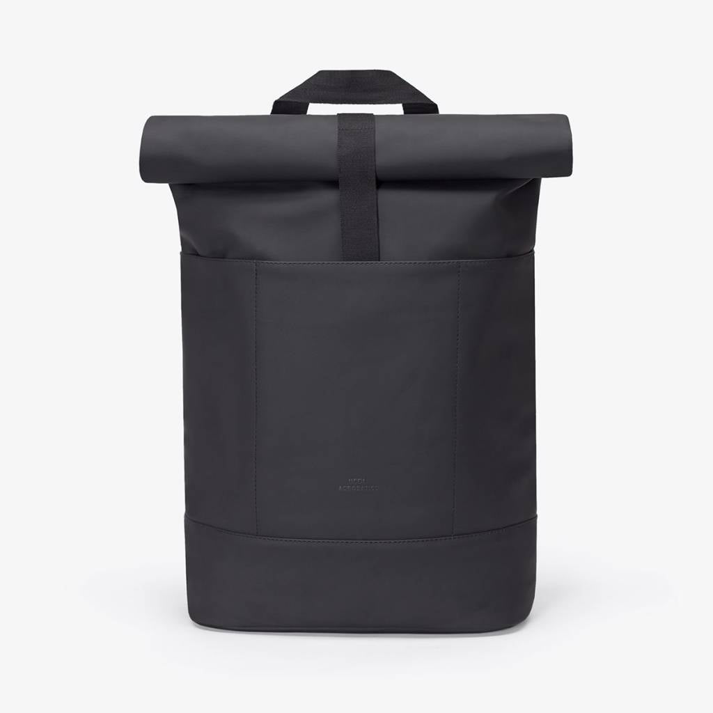 Hajo Lotus Black Backpack featuring waterproof material and roll-top closure for durability and style.