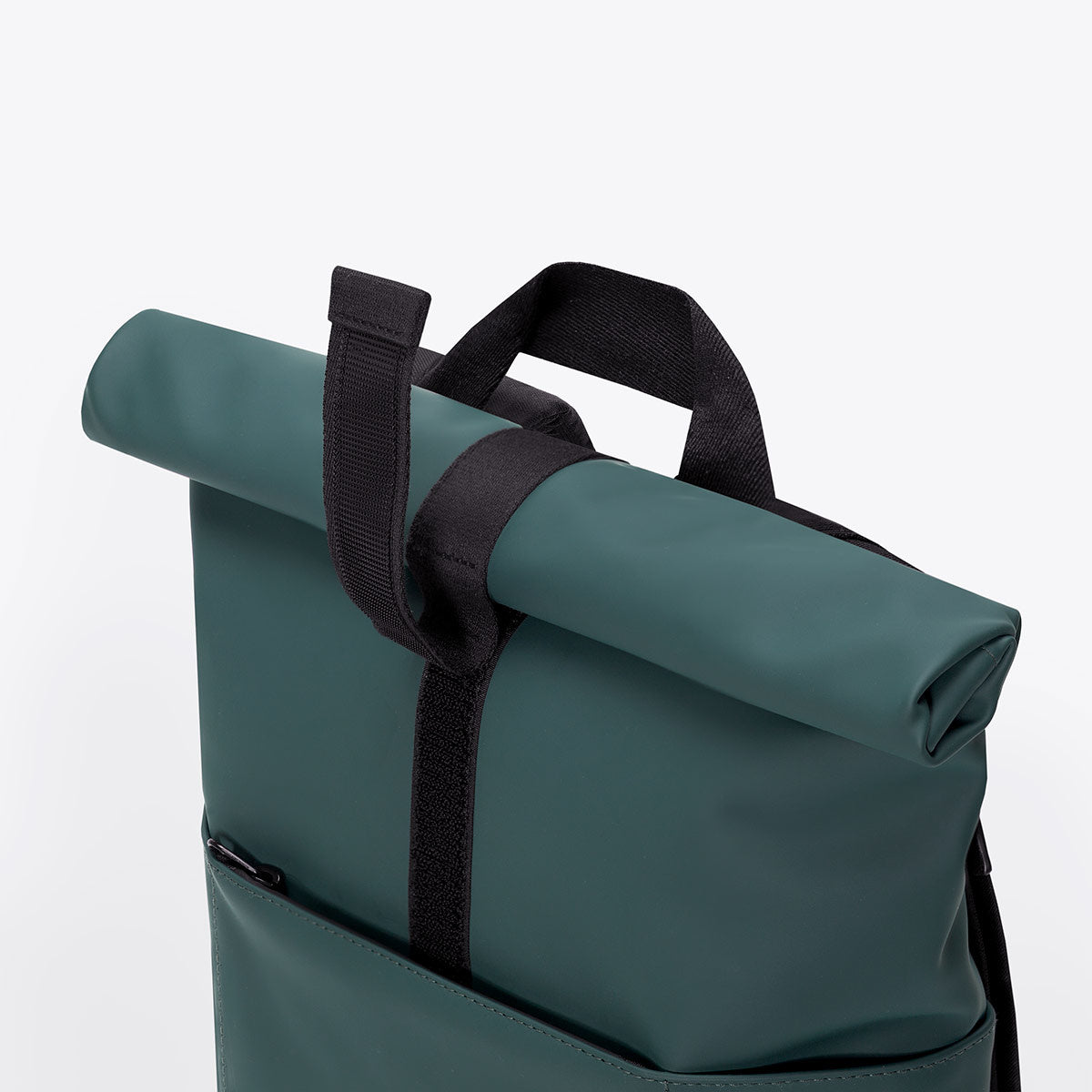 Hajo Macro Lotus Forest Backpack waterproof roll-top closure detail in green color.
