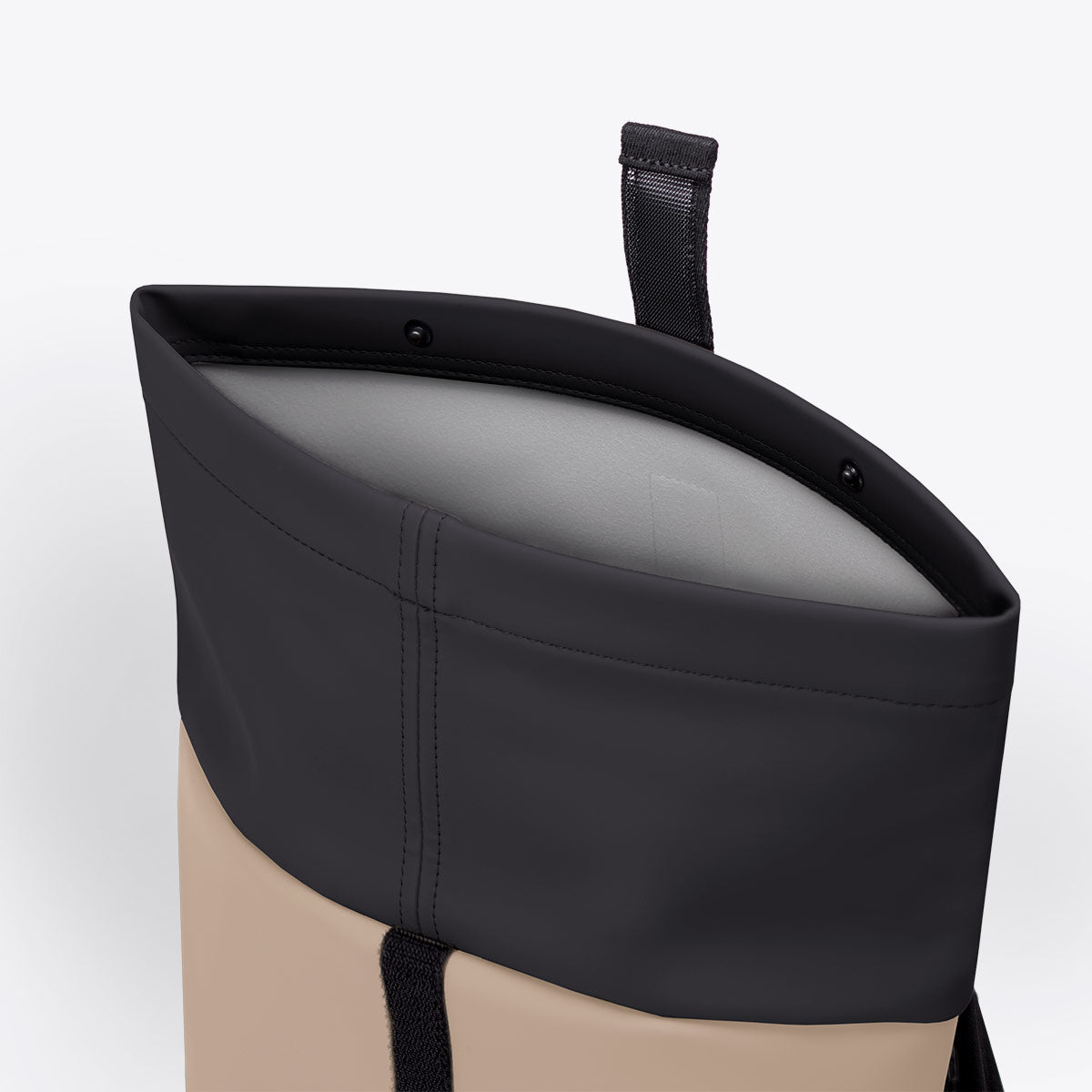 Hajo Mini Lotus Nude Petrol Backpack showing roll-top closure and waterproof material