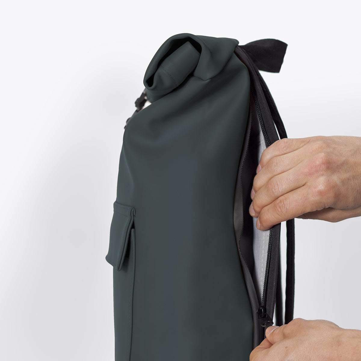 Jasper Lotus Forest Backpack showcasing the roll-top closure and side zipper for easy access.