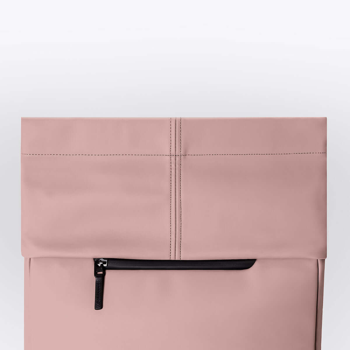 Kito Mini Lotus Rose Backpack waterproof roll-top closure and front zip pocket detail.