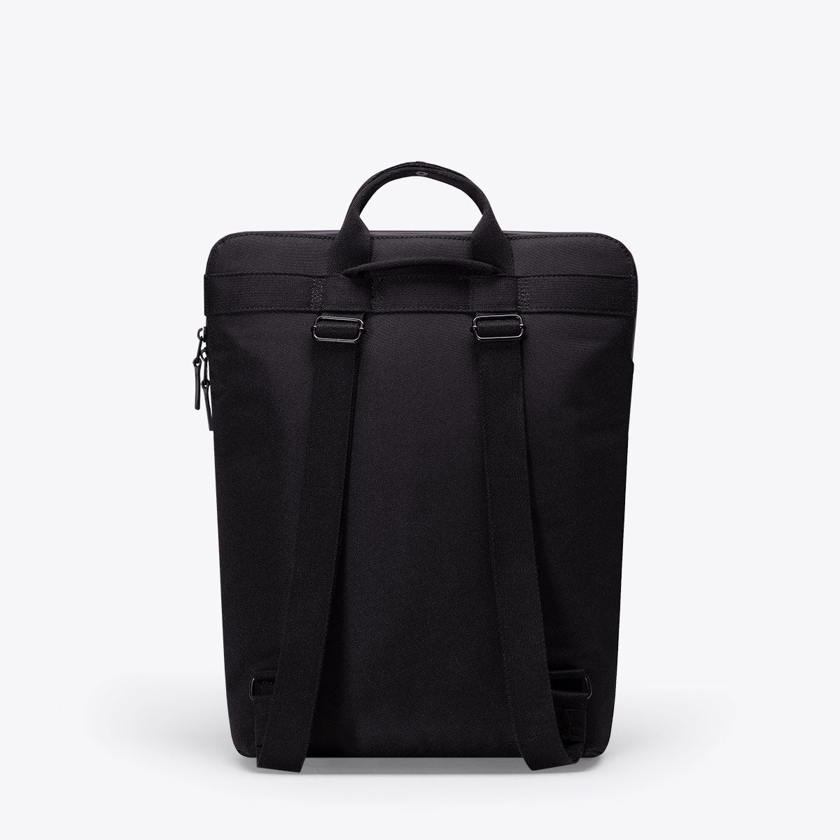 Masao Lotus Black Backpack featuring a sleek design with straps and handles for versatility and style.