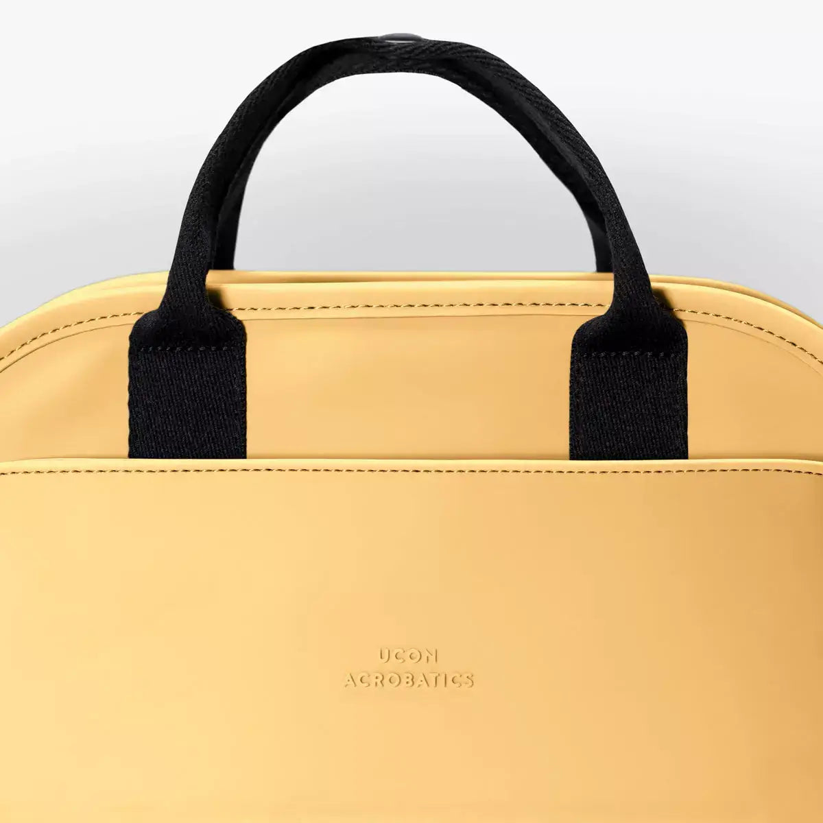 Alison Lotus Infinity Lemon Backpack featuring waterproof material and adjustable shoulder straps.