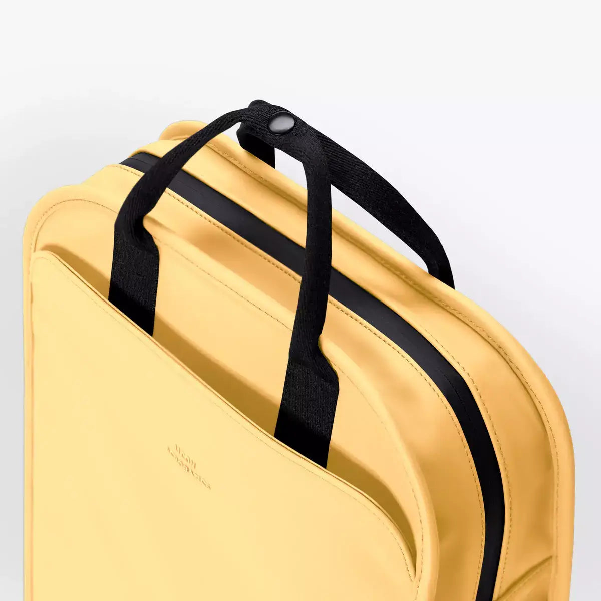 Alison Lotus Infinity Lemon Backpack in yellow, showcasing its stylish design and sturdy handles.
