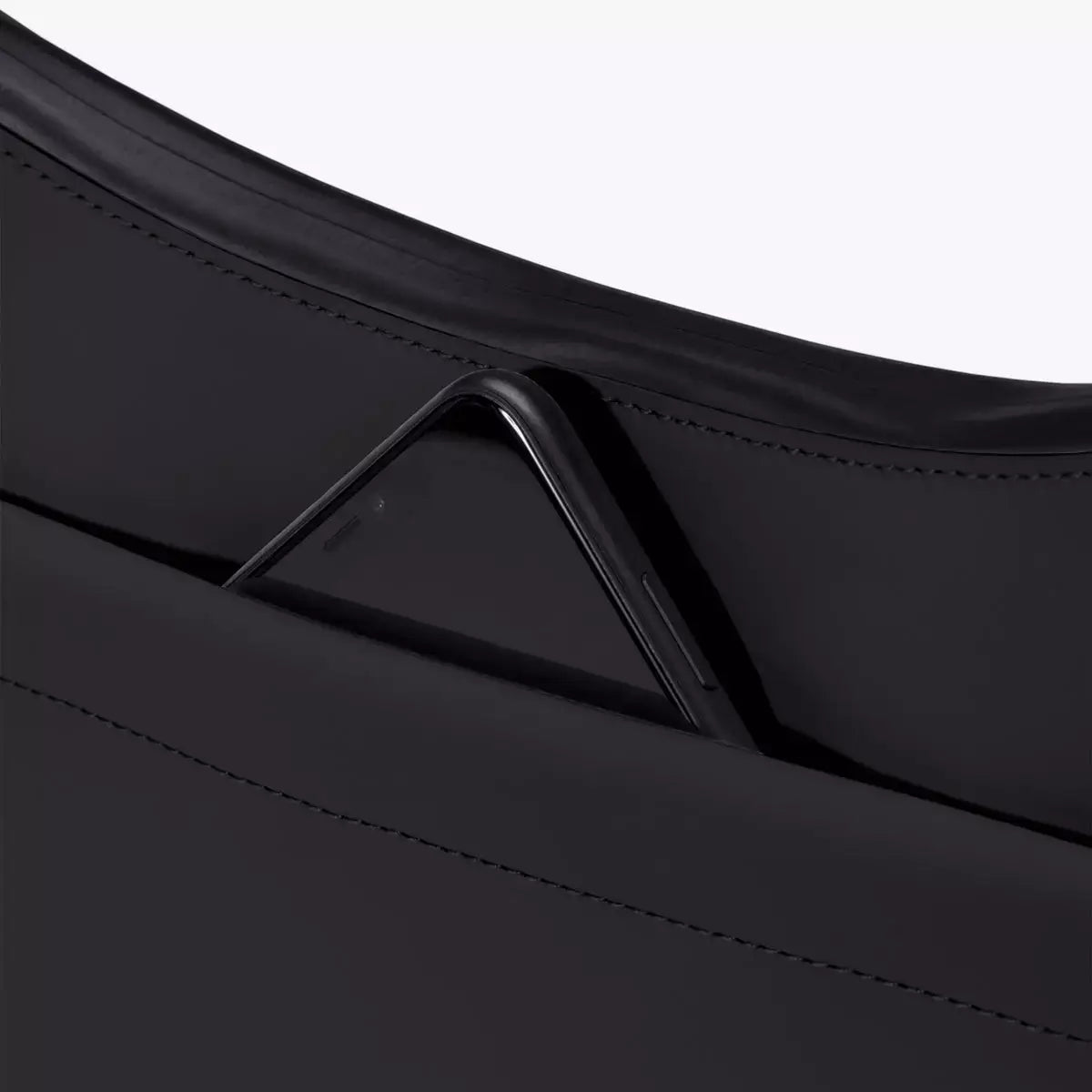 Alva Medium Lotus Infinity Black Shoulder Bag with smartphone in front pocket close-up