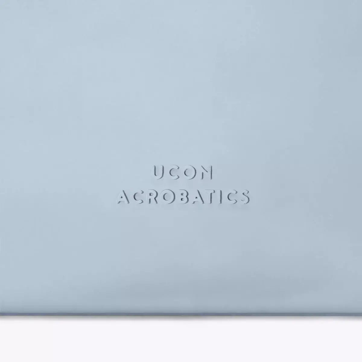 Alva Medium Lotus Infinity Fog Blue Shoulder Bag with UCON ACROBATICS branding in soft blue color.