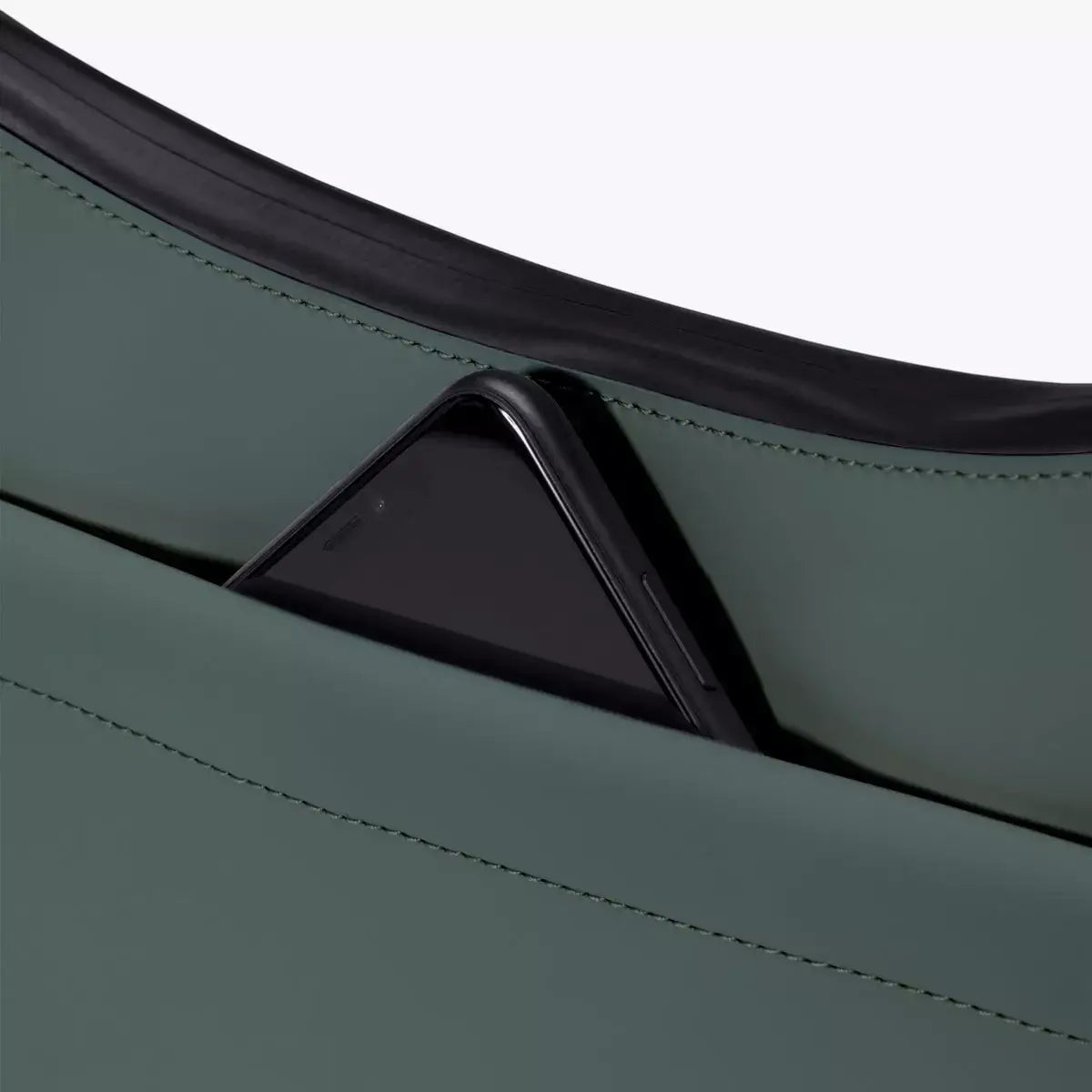 Alva Medium Lotus Infinity Pine Green Shoulder Bag showing phone in pocket