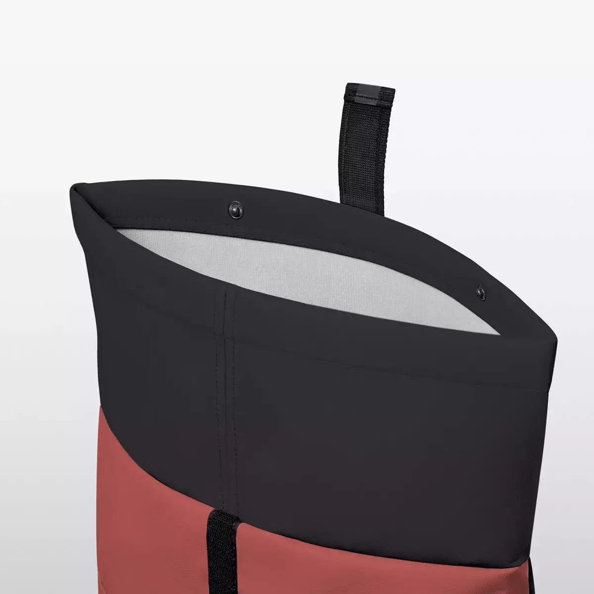 Hajo Aloe Hibiscus Black Backpack roll-top closure showcasing waterproof material and inside lining.