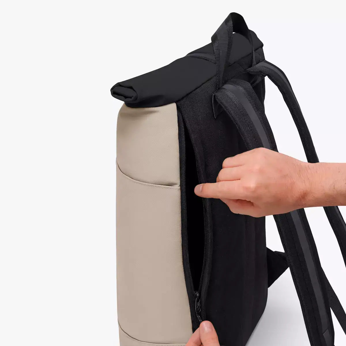 Hajo Aloe Sand Black Backpack showing extra side zipper and roll-top closure design.