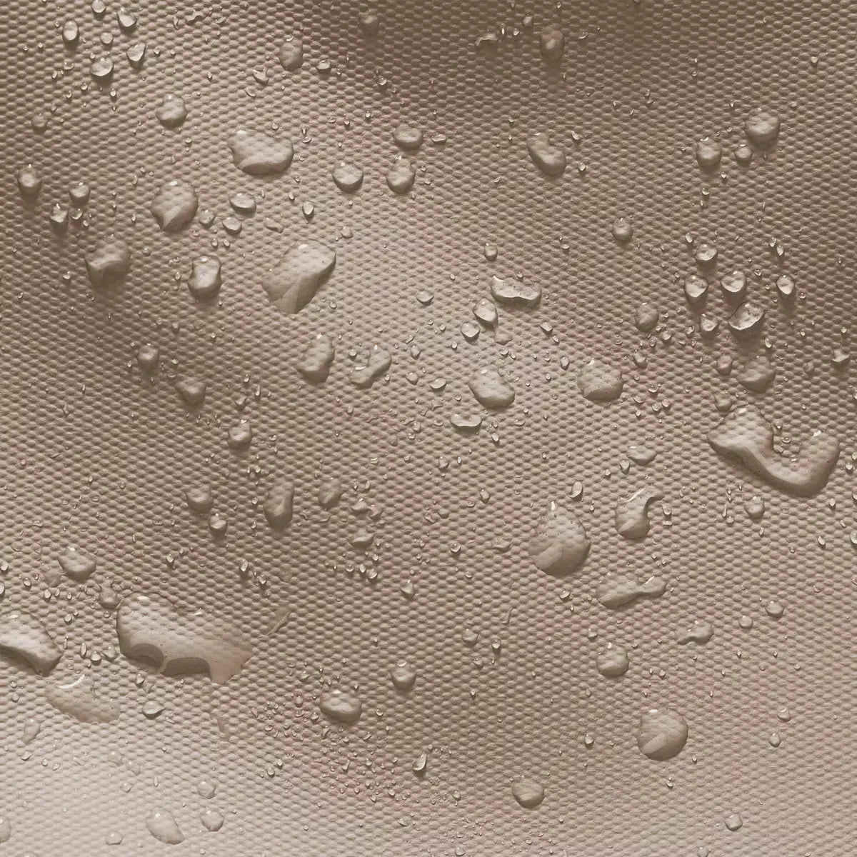 Hajo Aloe Sand Black Backpack fabric showing waterproof and dirt repellent qualities with water droplets.