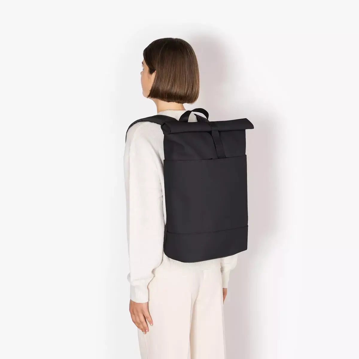 Hajo Lotus Infinity Black Backpack worn by a model showcasing its sleek design and durability.