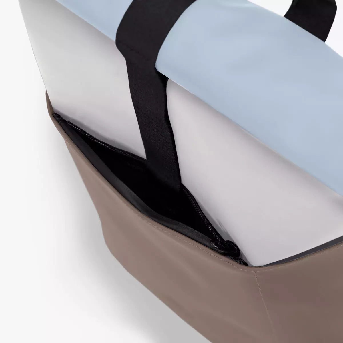 Close-up of the Hajo Lotus Infinity Glacier Grey Dark Sand Backpack showing the side zipper and material details.