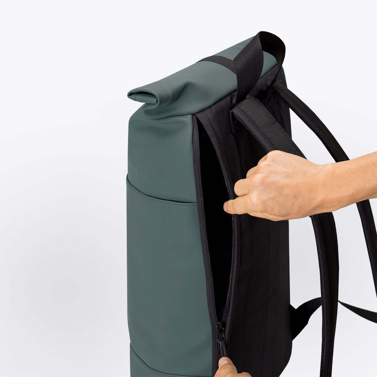 Hajo Lotus Pine Green Backpack showcasing waterproof roll-top closure and side zipper.