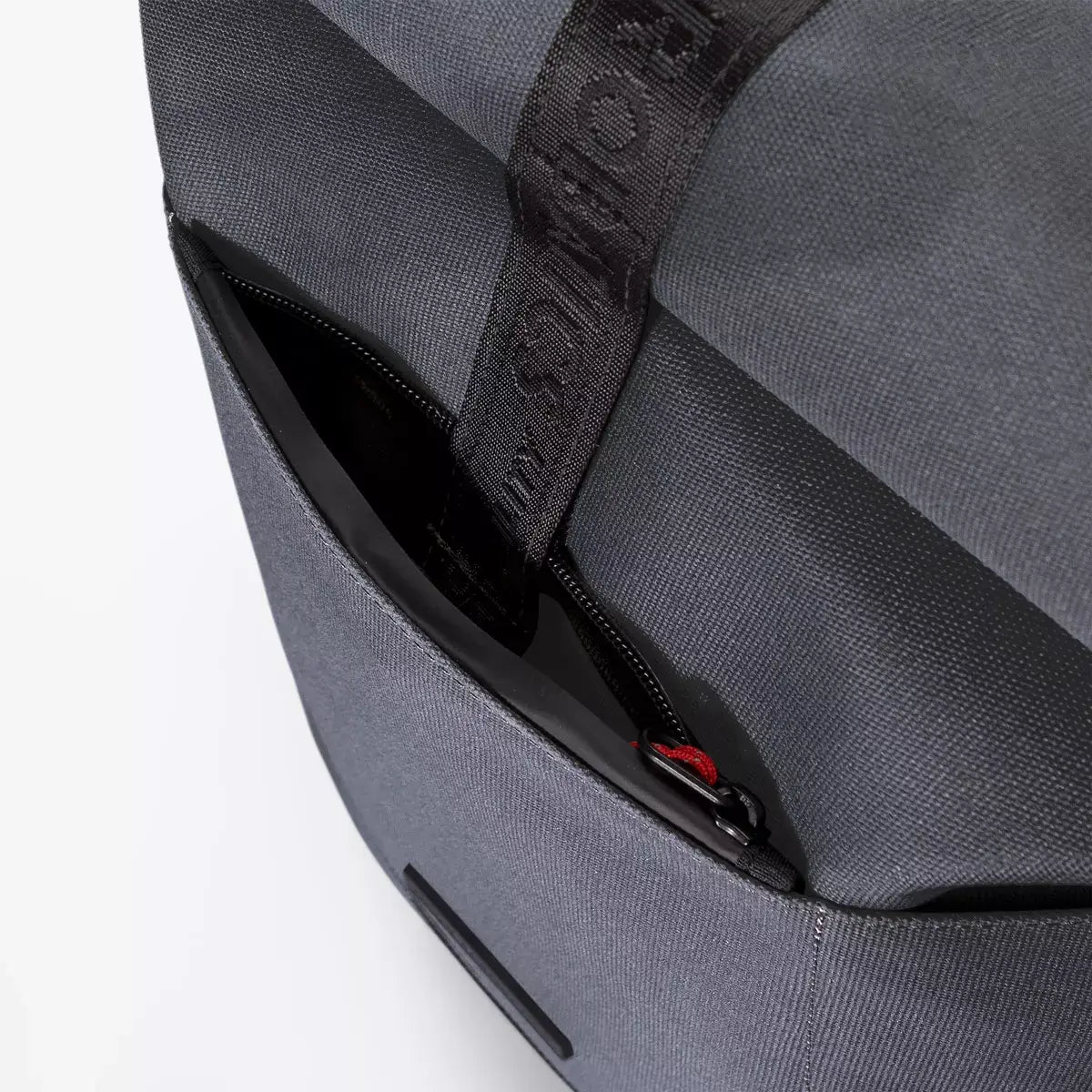 Hajo Phantom Ocean Blue Reflective Backpack showing side zipper compartment for easy access.