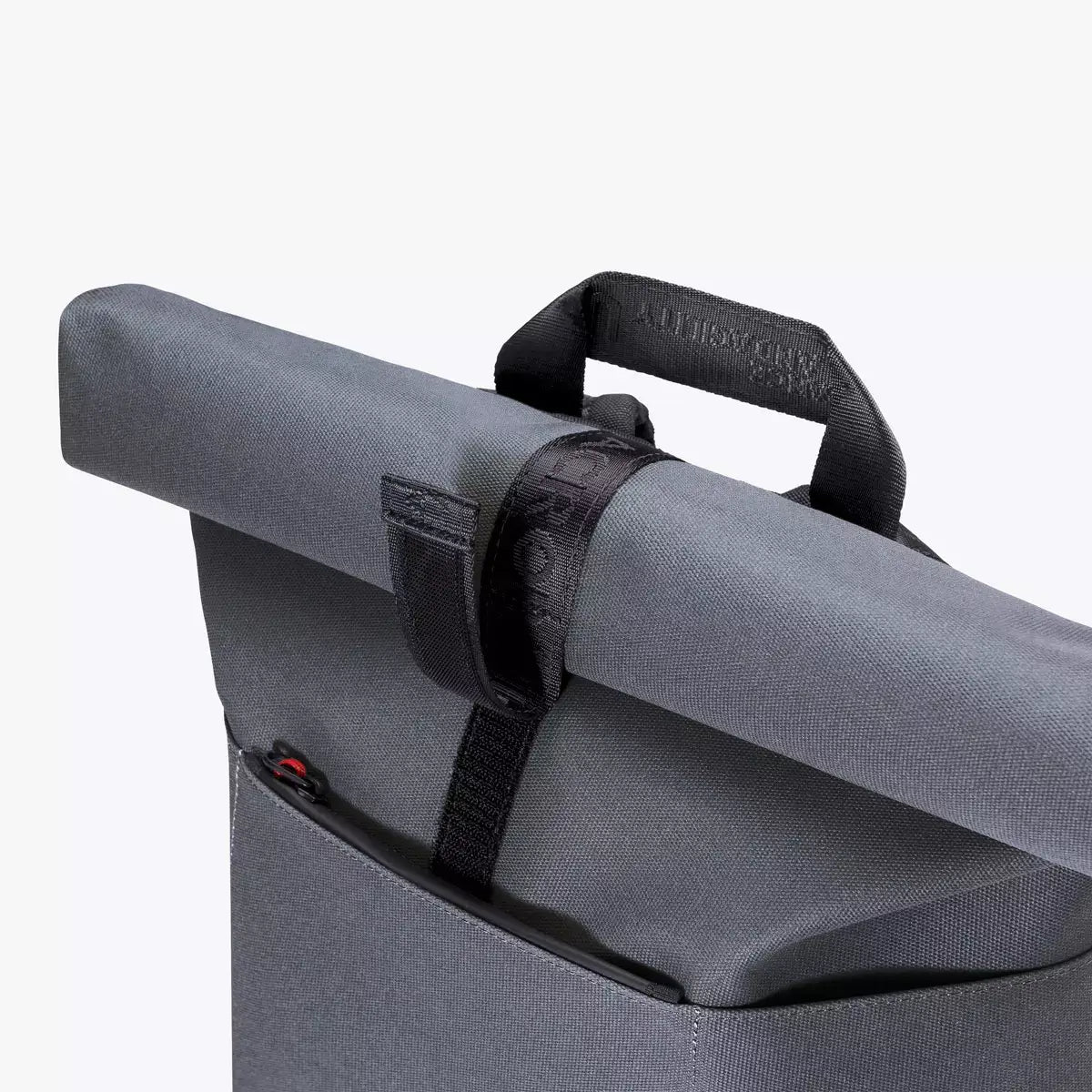 Hajo Phantom Ocean Blue Reflective Backpack roll-top closure and handle detail, waterproof and dirt repellent design.