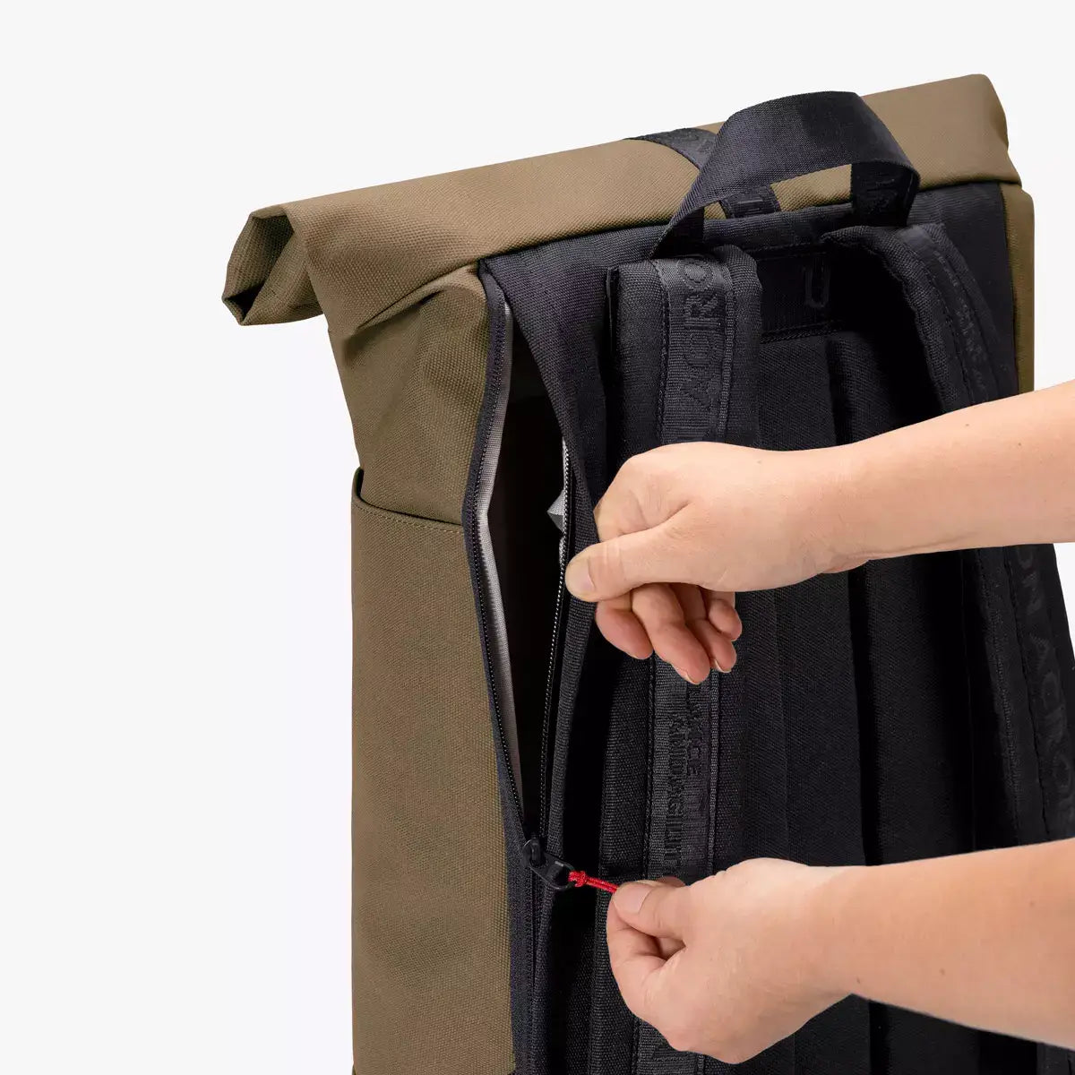 Hajo Phantom Olive Reflective Backpack close-up of the side zipper and padded straps for added comfort.