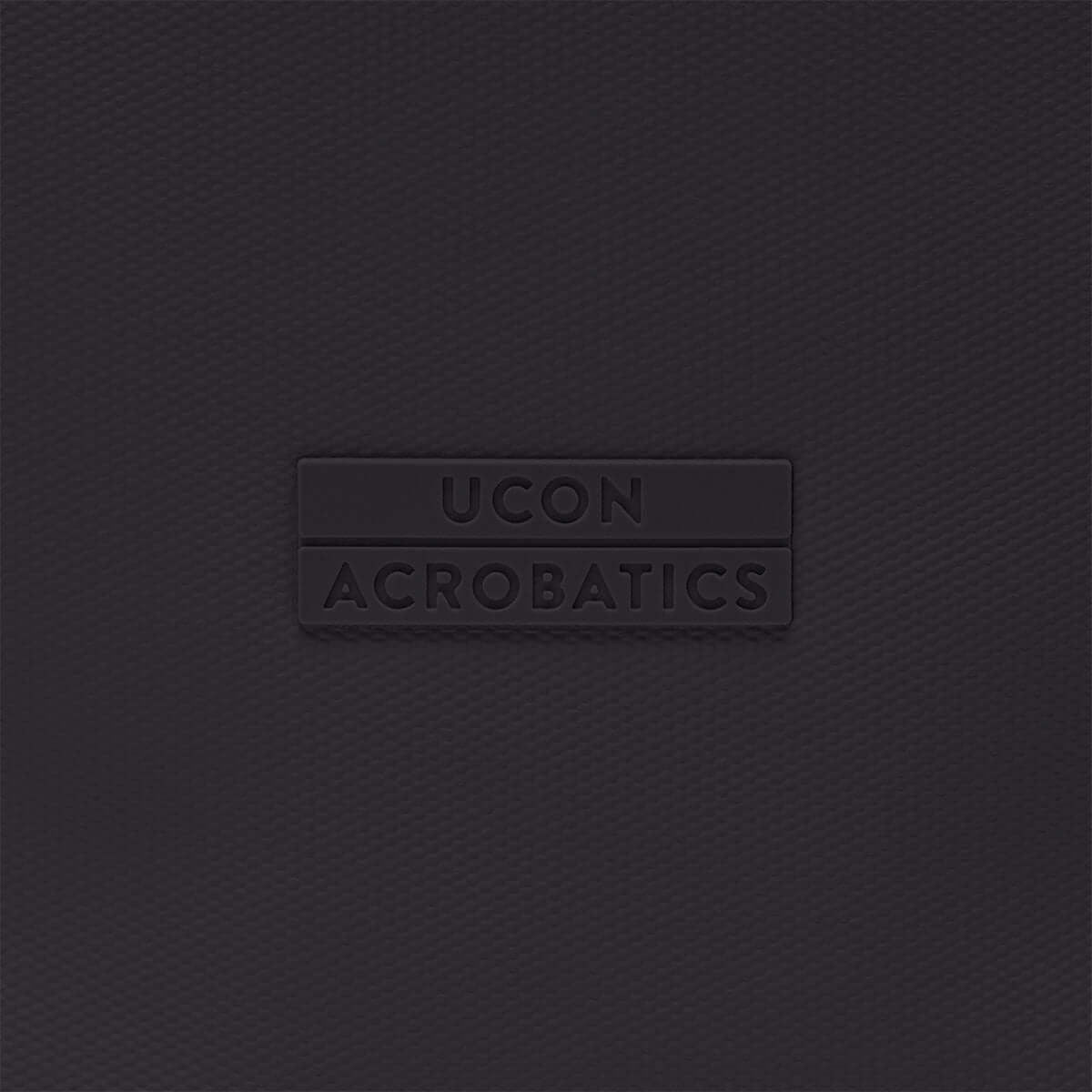 UCON Acrobatics logo on a textured dark background, representing a stylish and modern brand.