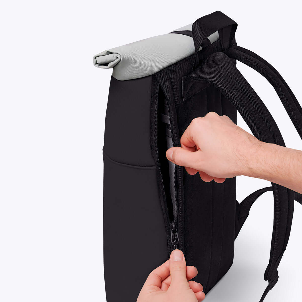 Hajo Mini Aloe Black Backpack side zipper detail showing waterproof design and padded straps.