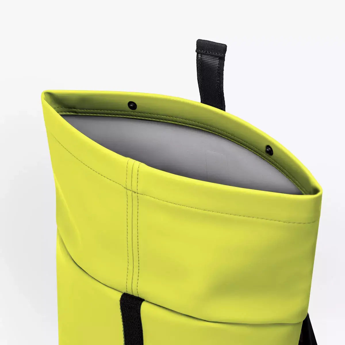 Interior view of Hajo Mini Lotus Acid Lime Backpack showcasing roll-top closure design and waterproof material.