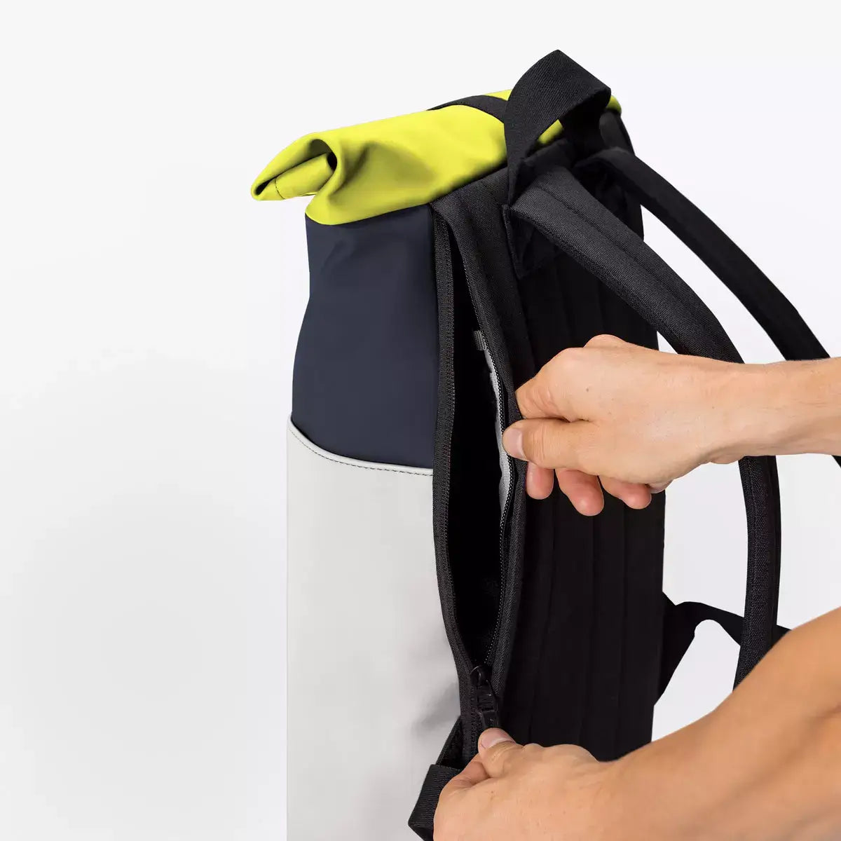 Hajo Mini Lotus Dark Navy Light Grey Backpack side zipper and roll-top closure in use.