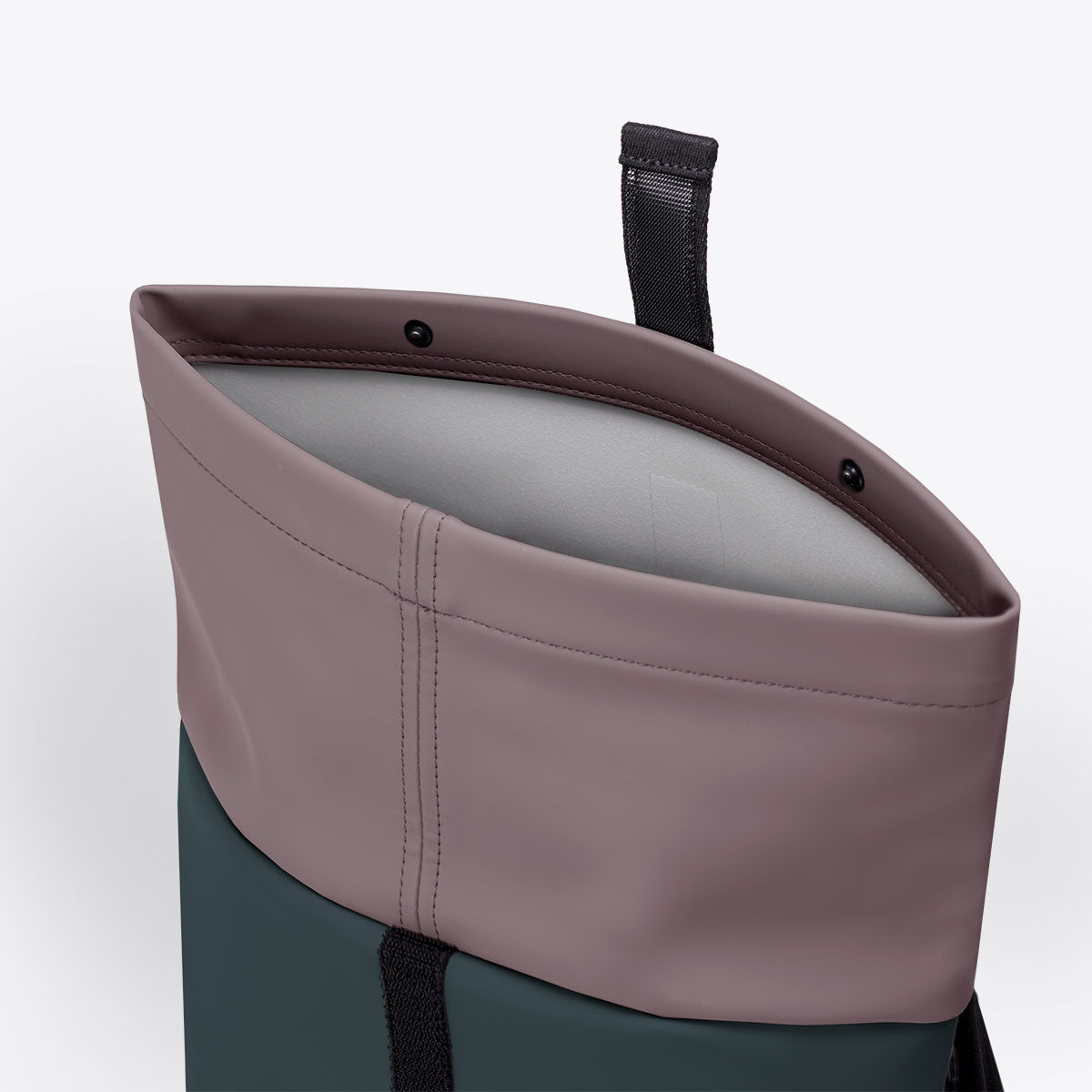 Hajo Mini Lotus Forest Pine Green Backpack open roll-top closure view showing interior design and waterproof material.