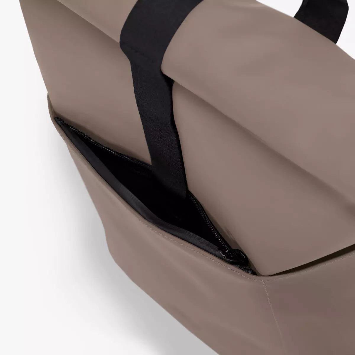 Detail view of Hajo Mini Lotus Infinity Dark Sand Backpack showing waterproof side zipper and durable material.