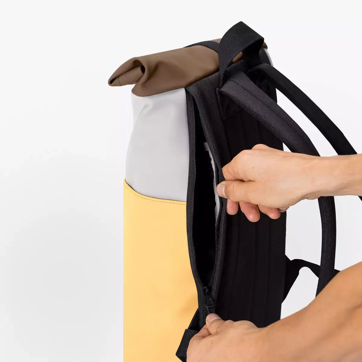 Hajo Mini Lotus Infinity Glacier Grey Lemon Backpack showing the side zipper and padded straps.