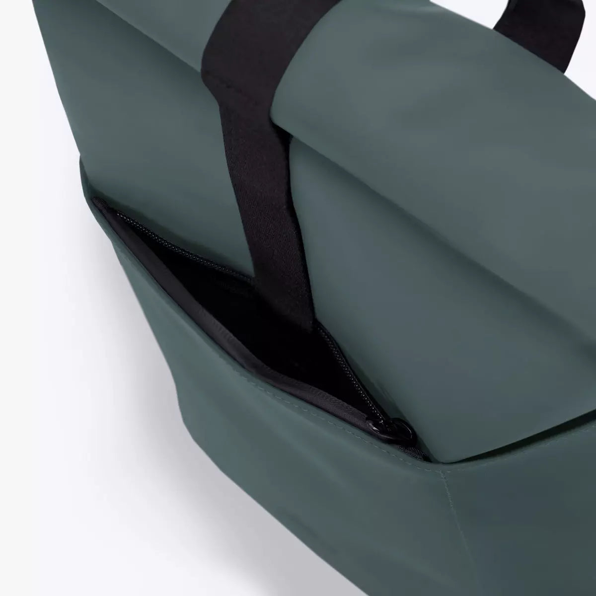 Hajo Mini Lotus Infinity Pine Green Backpack showing waterproof side zipper and durable material.