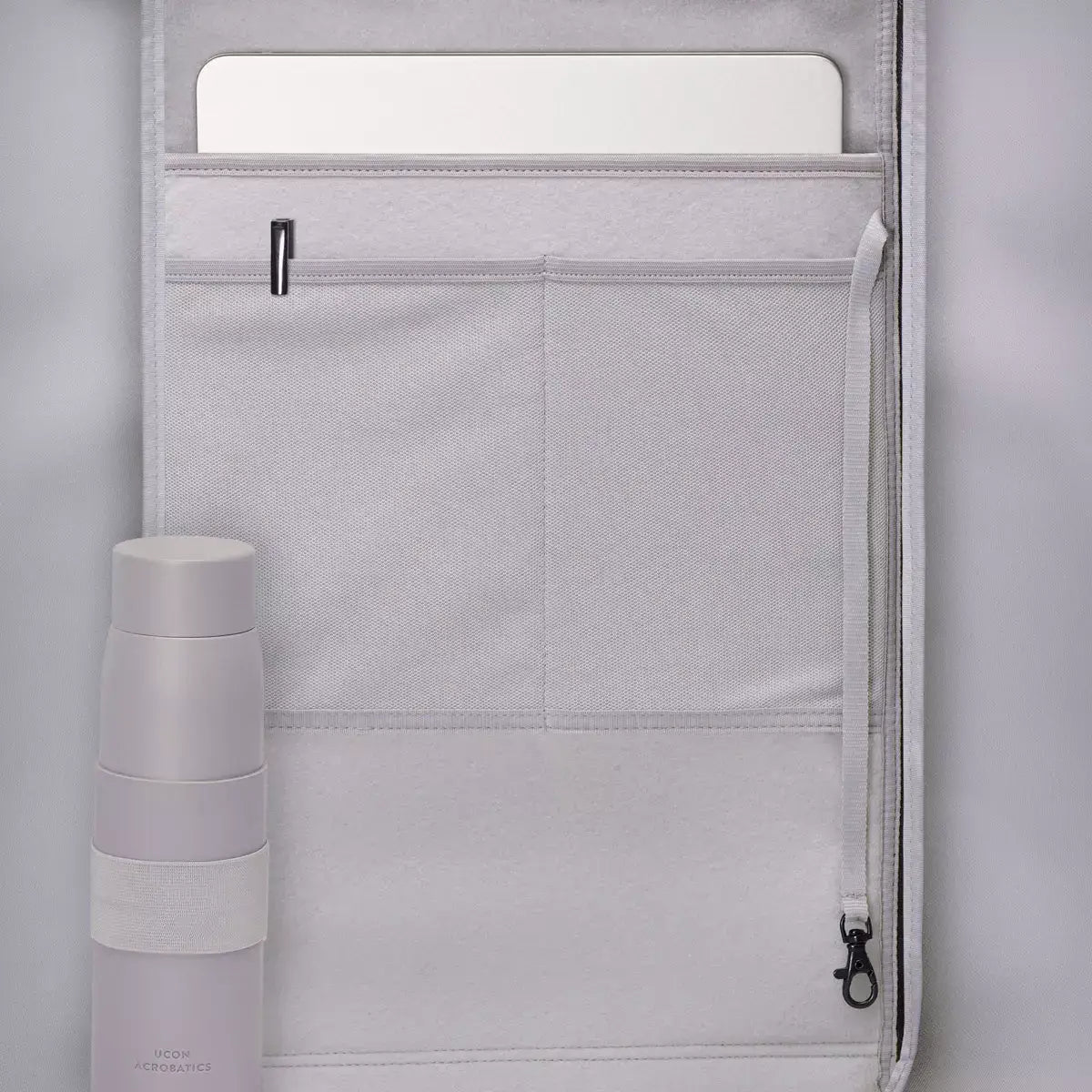 Interior view of Hajo Mini Lotus Infinity Pine Green Backpack showing padded laptop compartment and water bottle holder.