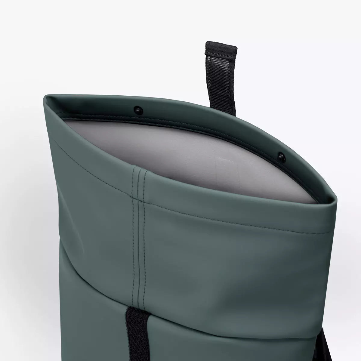 Hajo Mini Lotus Infinity Pine Green Backpack top view showing waterproof material and padding.
