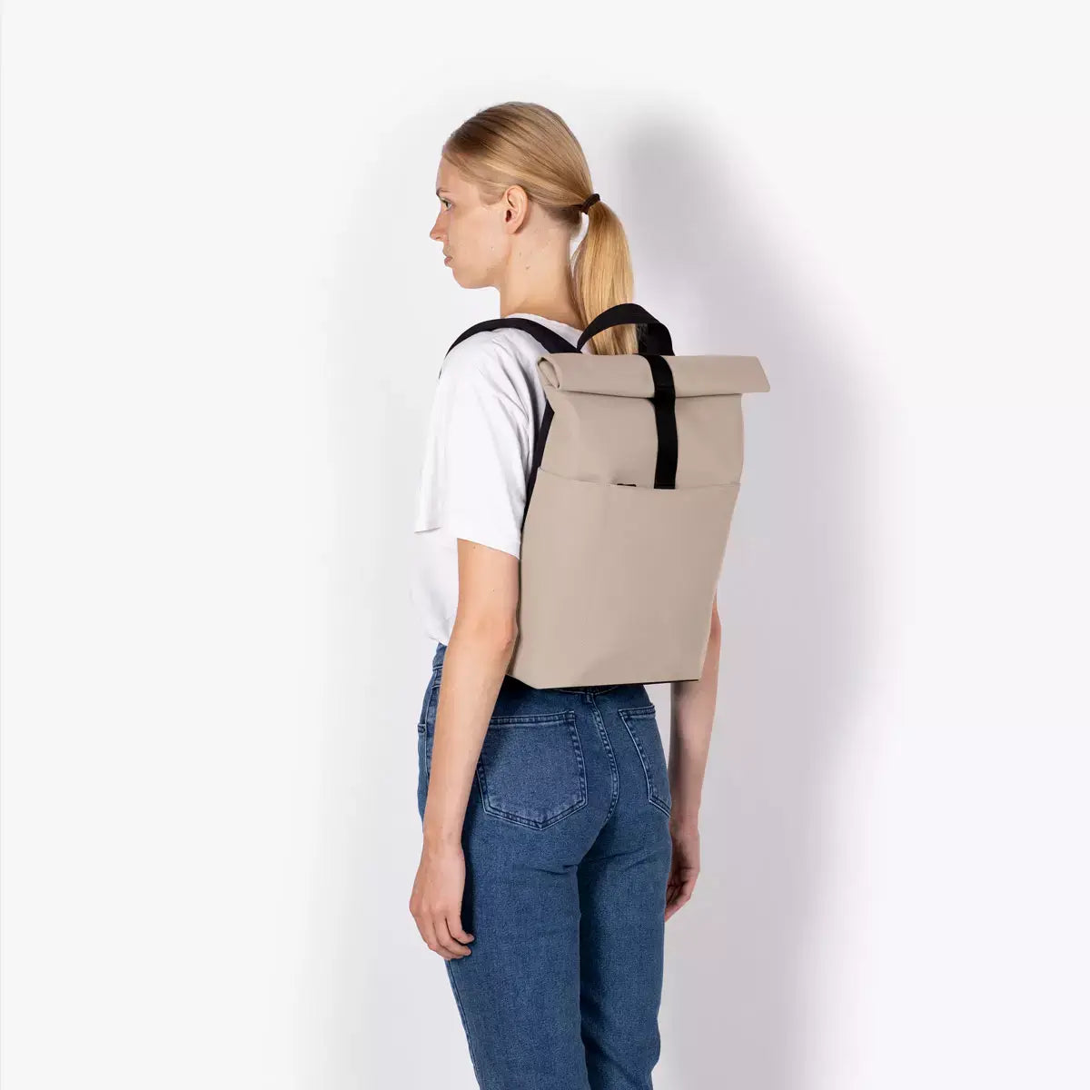 Hajo Mini Lotus Infinity Sand Backpack worn on a model, showcasing its stylish design and functionality.