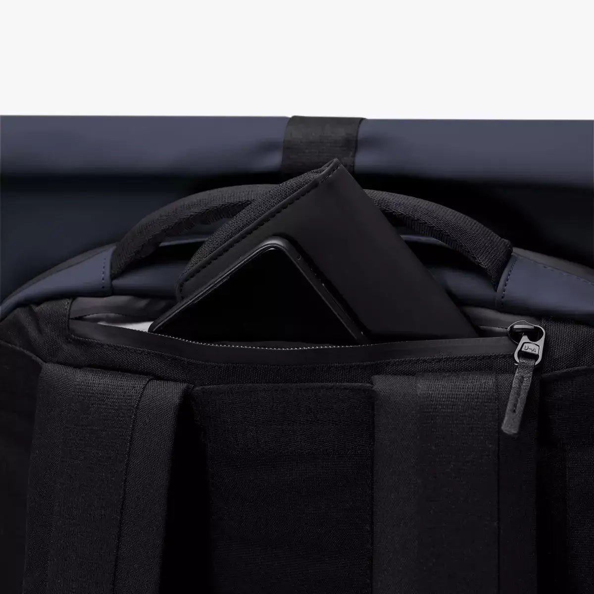 Hajo Pro Lotus Dark Navy Backpack featuring a secure compartment for a laptop or device.