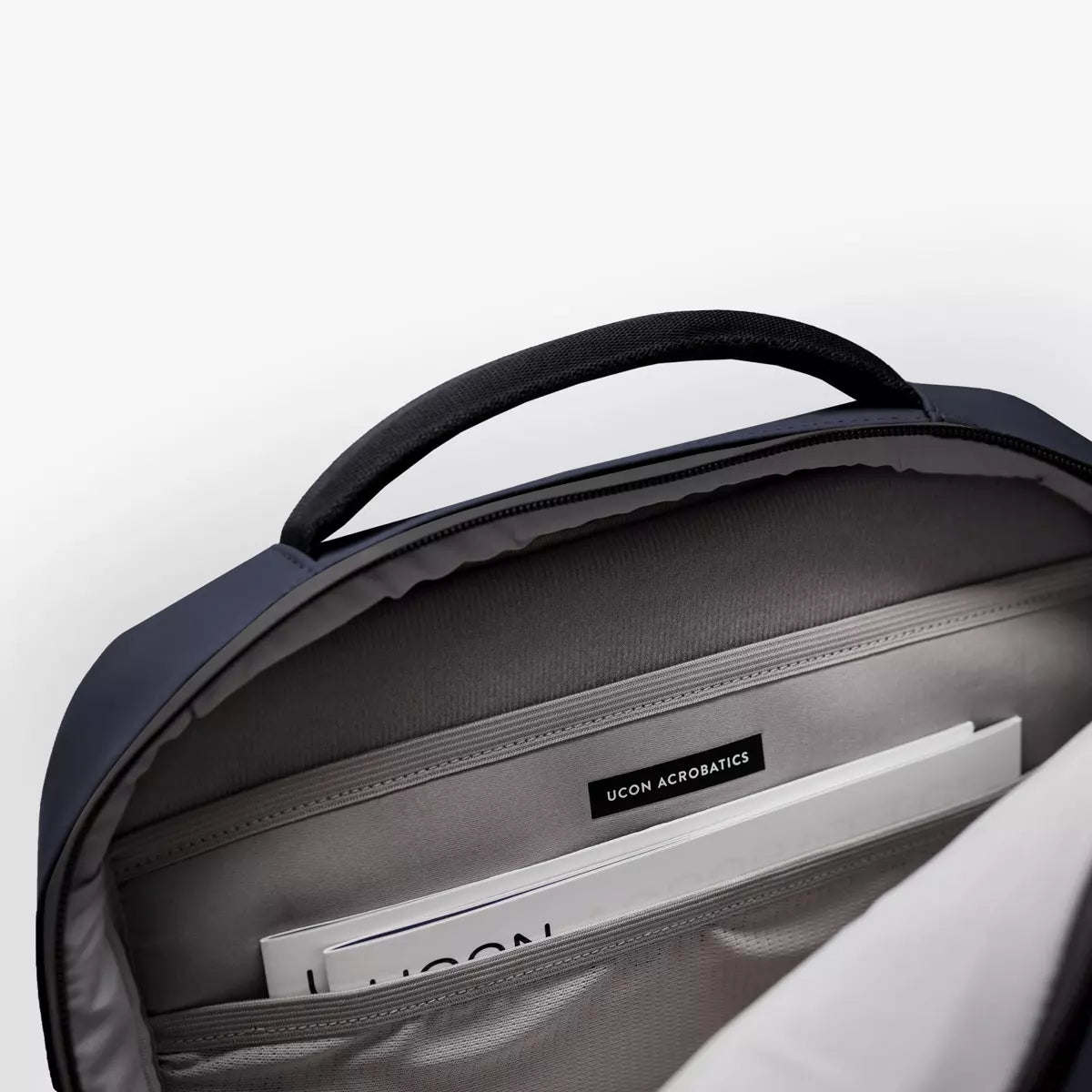 Hajo Pro Lotus Dark Navy Backpack interior view showcasing compartments and organization features
