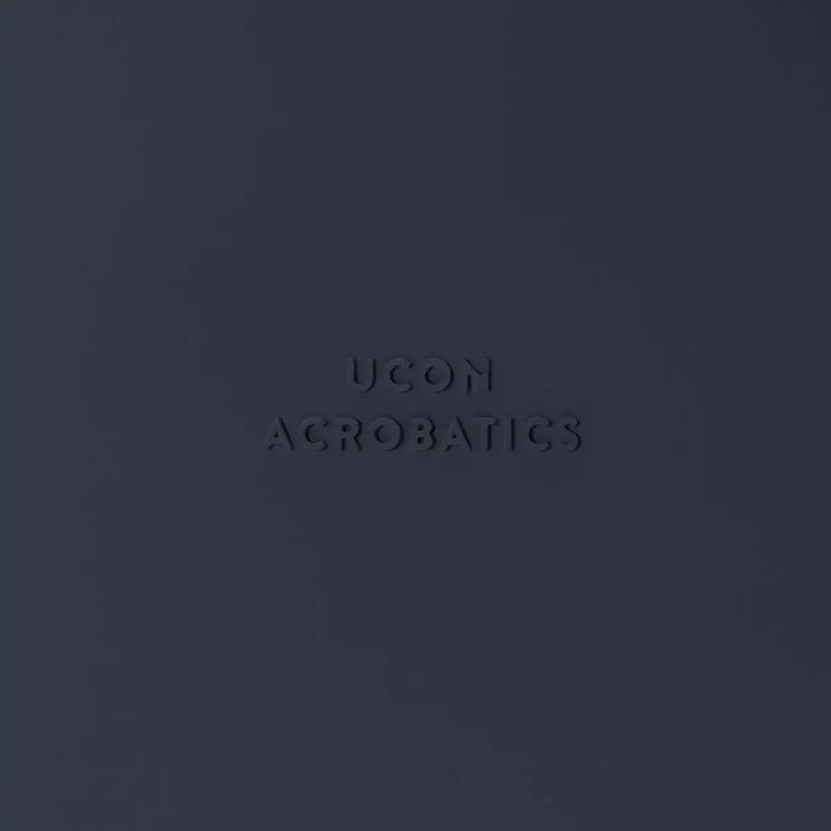 Jannik Medium Lotus Infinity Dark Navy Backpack logo on a dark navy background.