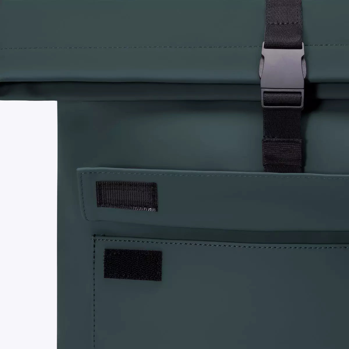 Close-up of the Jannik Medium Lotus Infinity Forest Backpack's roll-top closure and side pocket.