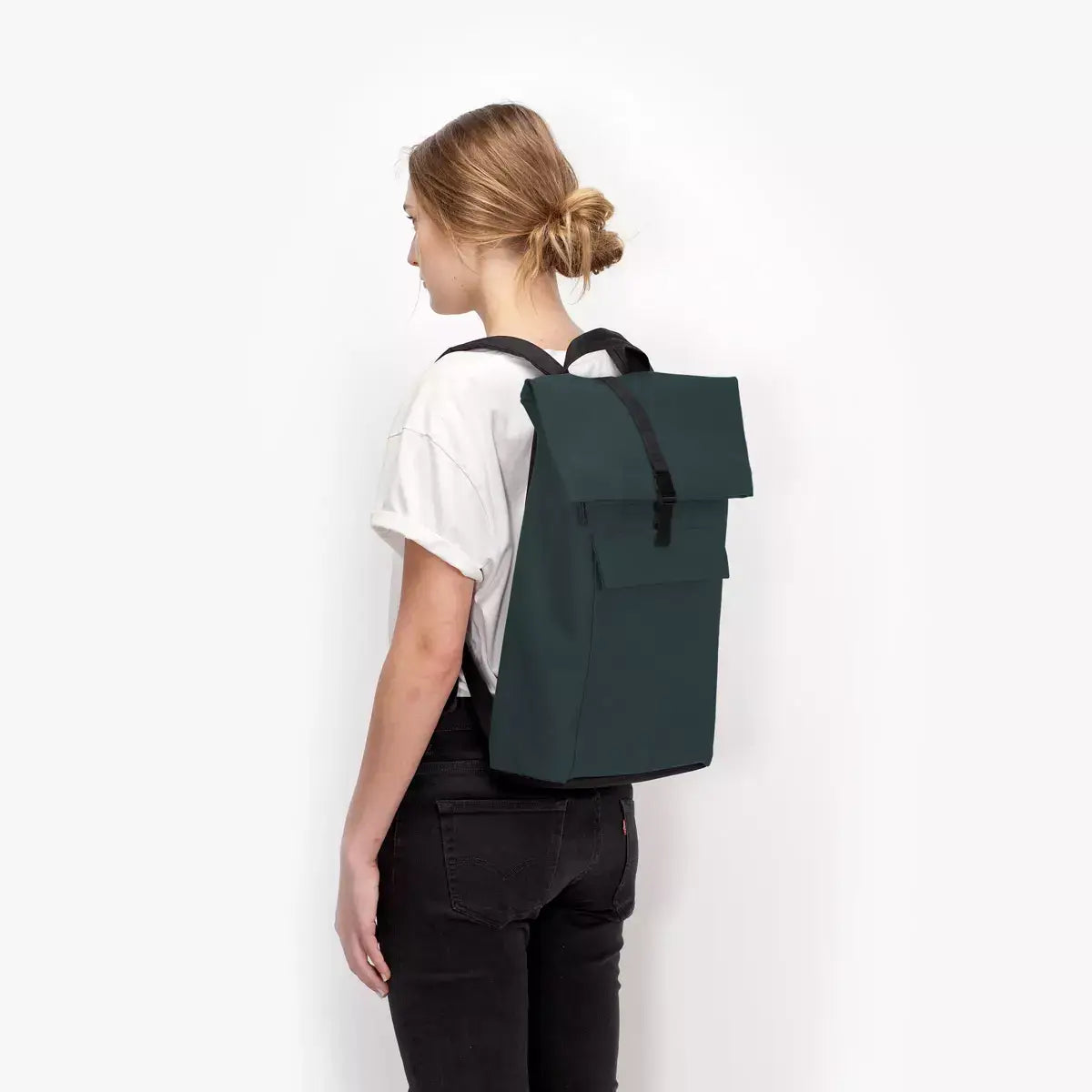 Jannik Medium Lotus Infinity Forest Backpack shown from the back, showcasing waterproof design and roll-top closure.