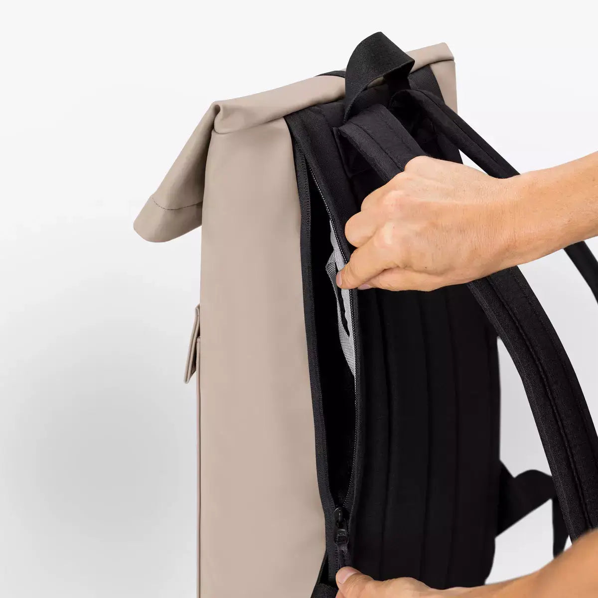 Jannik Medium Lotus Infinity Sand Backpack showcasing side zipper and roll-top closure