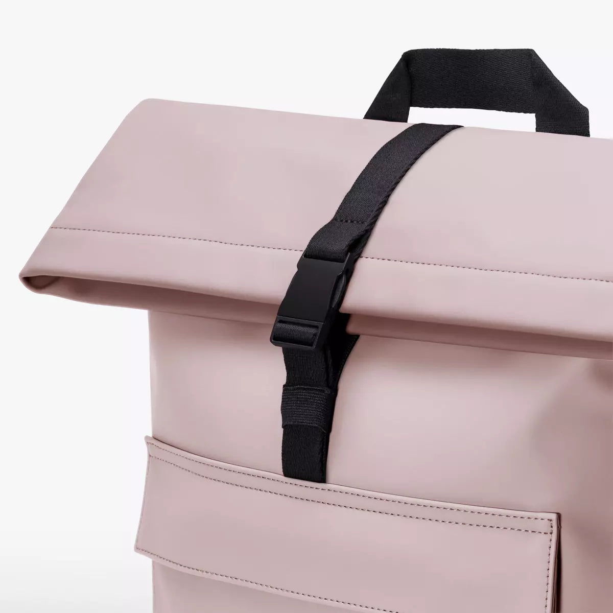 Close-up view of Jannik Mini Lotus Infinity Light Rose Backpack showcasing the roll-top closure and buckle.