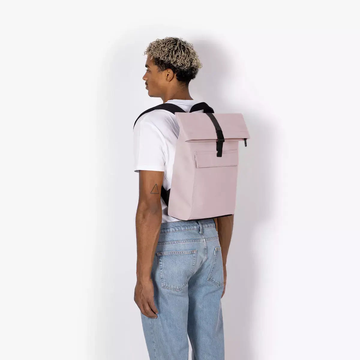Jannik Mini Lotus Infinity Light Rose Backpack displayed on a model, showcasing durability and stylish design.
