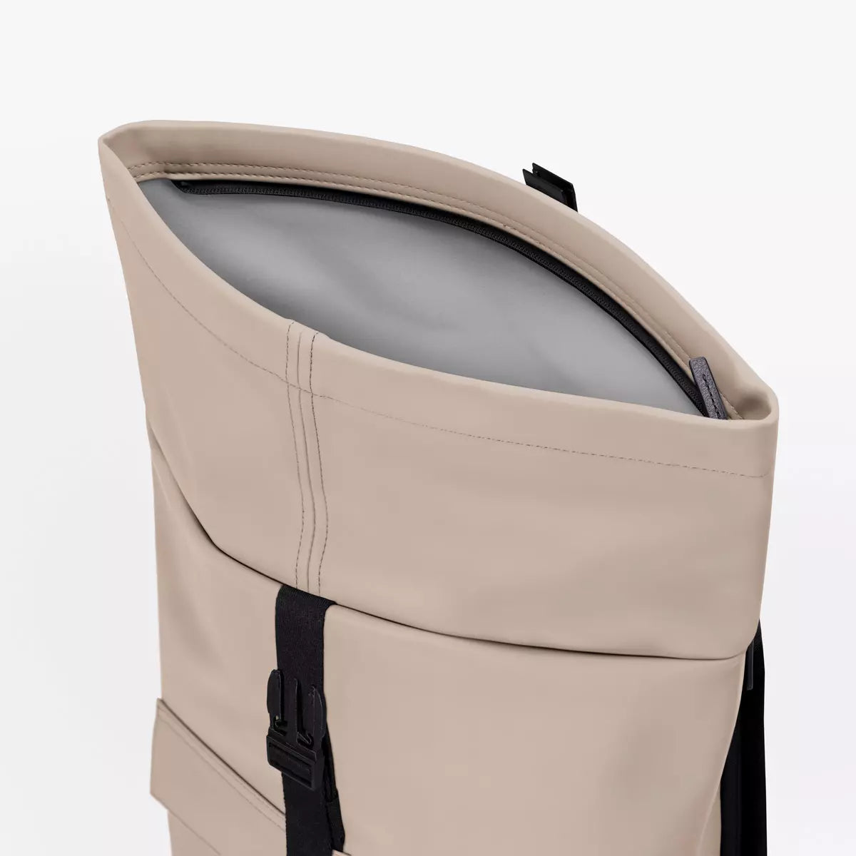 Jannik Mini Lotus Infinity Sand Backpack roll-top closure detail with waterproof material