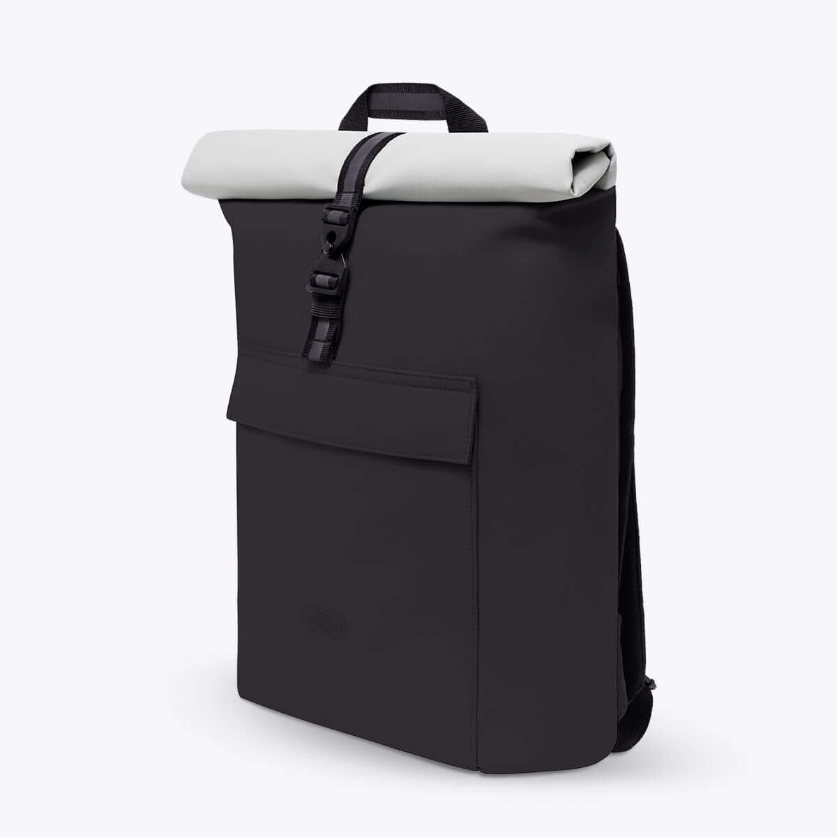 Jasper Aloe Black Backpack featuring waterproof design, roll-top closure, and extra side zipper.