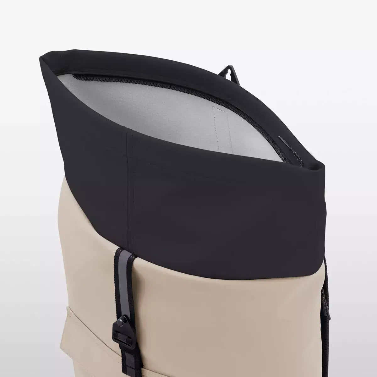 Jasper Aloe Sand Black Backpack roll-top closure with metal clip detail showing waterproof material