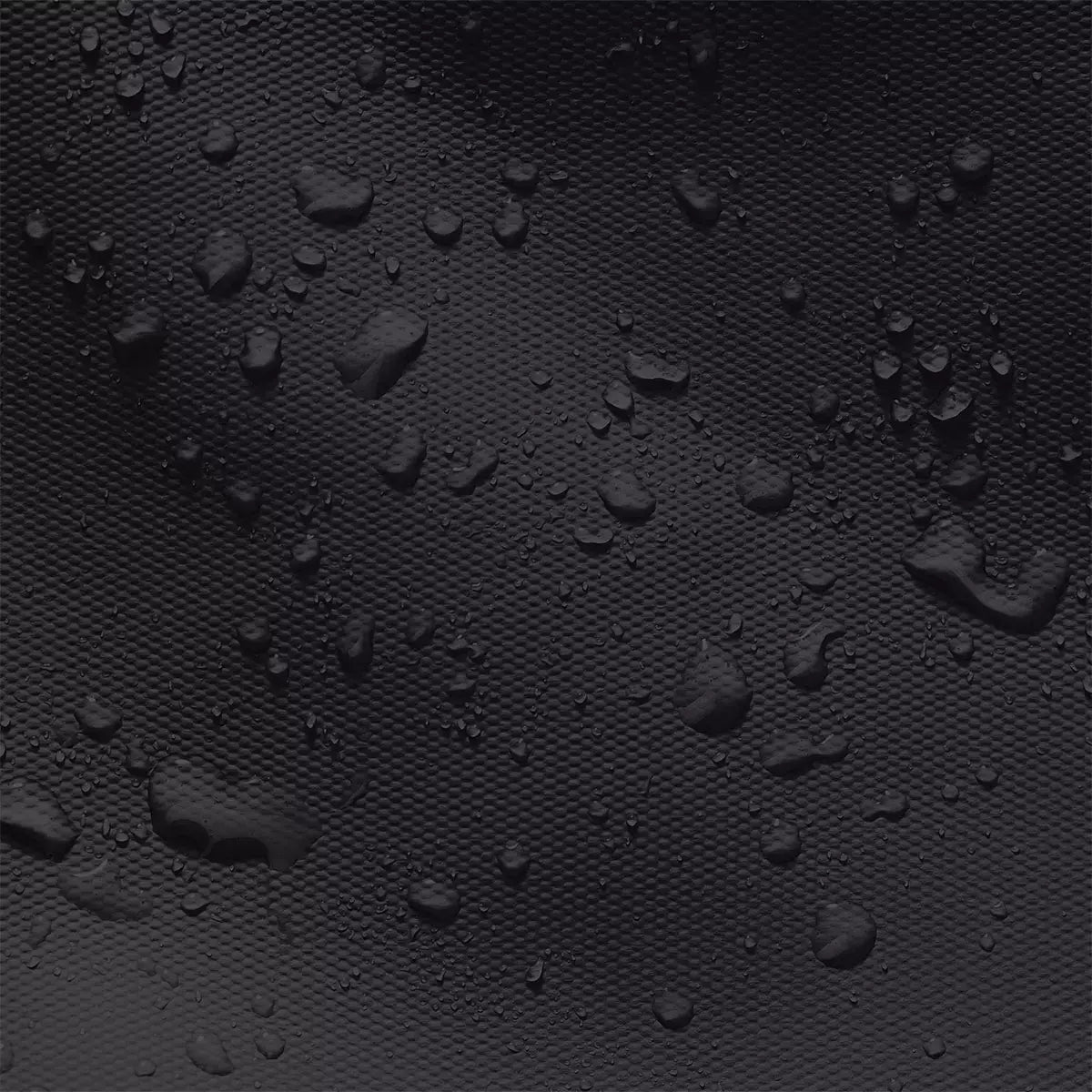 Close-up of waterproof material showcasing droplets, used in the Jona Lotus Aloe Black Bum Bag.