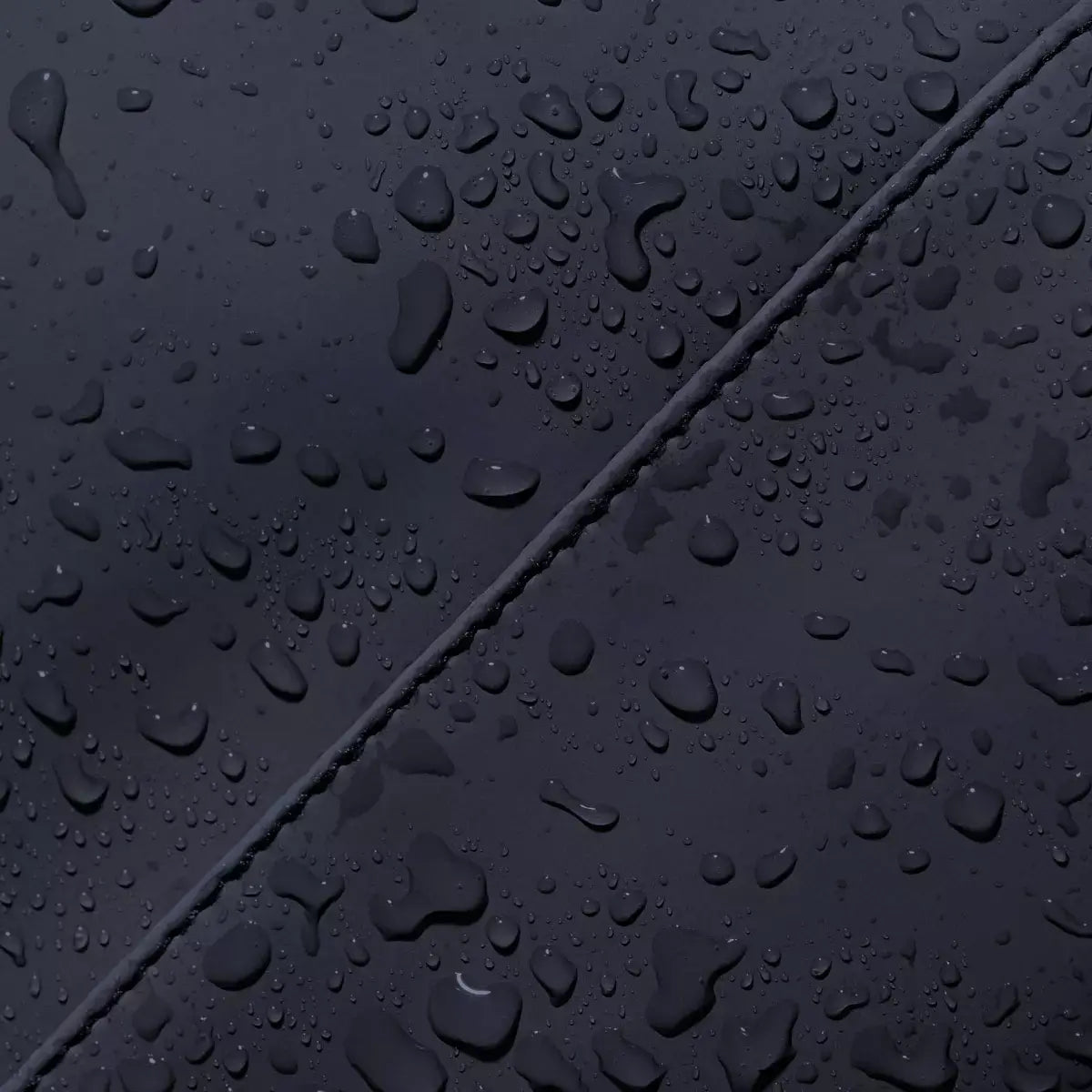 Waterproof surface detail of Jona Lotus Infinity Dark Navy Bum Bag showcasing a water-resistant material.